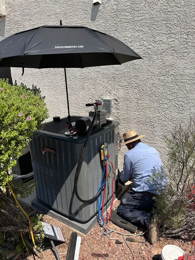 HVAC technician performing outdoor AC maintenance in Southampton